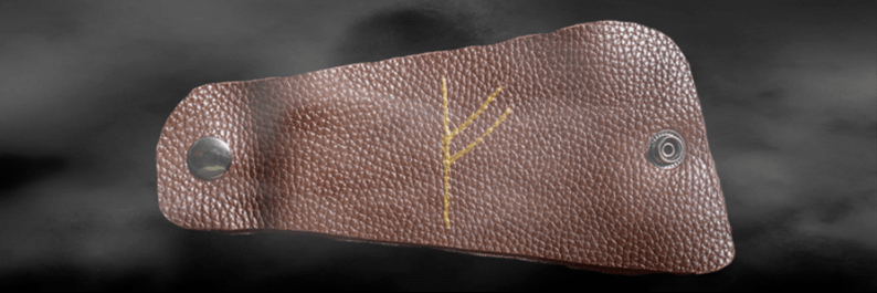 Fehu rune บนผิวหนังเป็นเครื่องรางแห่งความโชคดี